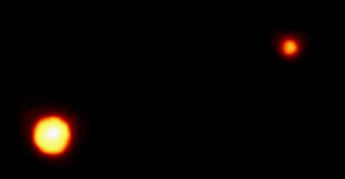 Плутон и Харон. Фотография сделана с помощью телескопа Хаббл